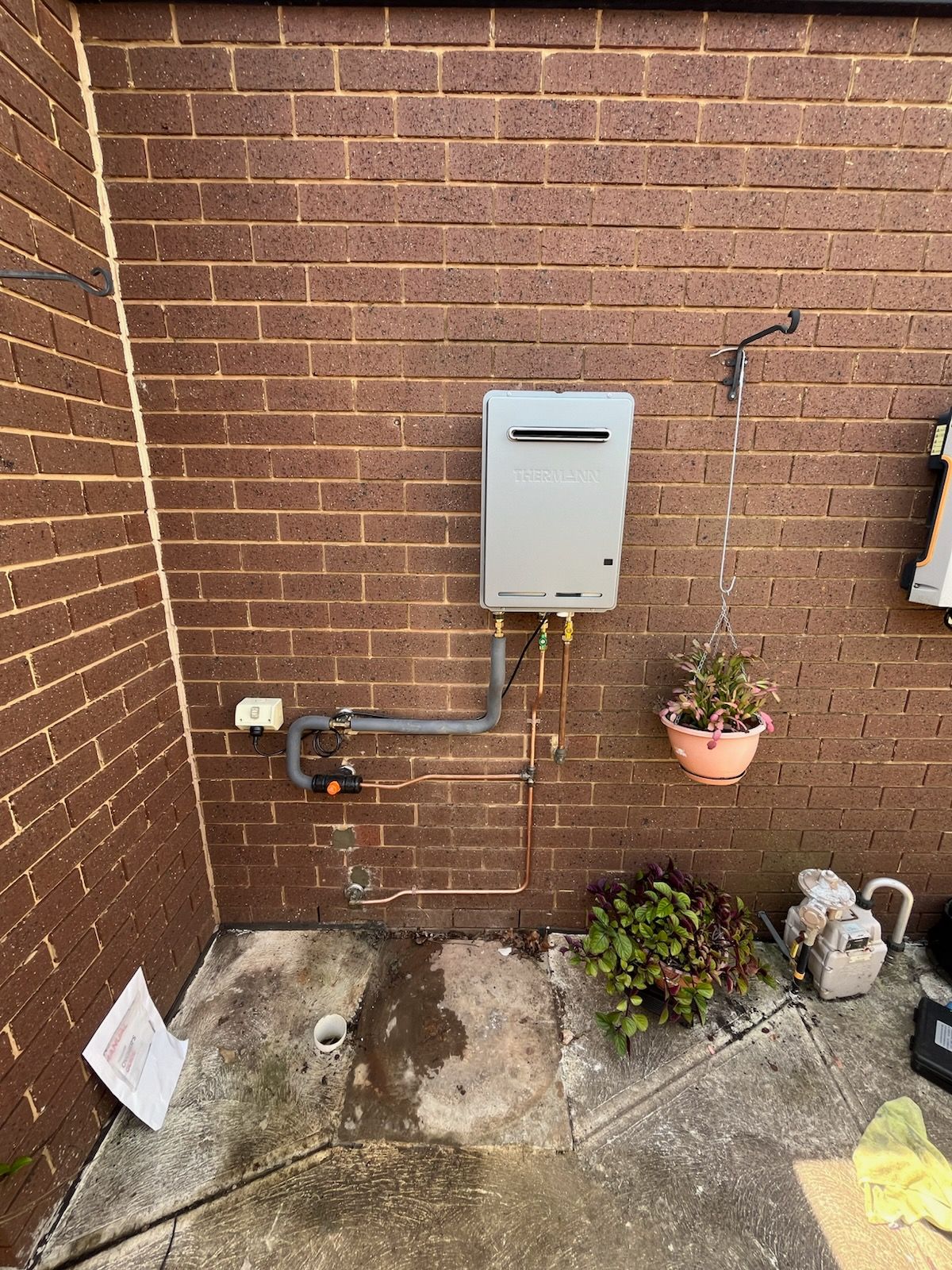 A Gas Heater on The Outside Wall of a House— Kerney Plumbing in Geelong, VIC
