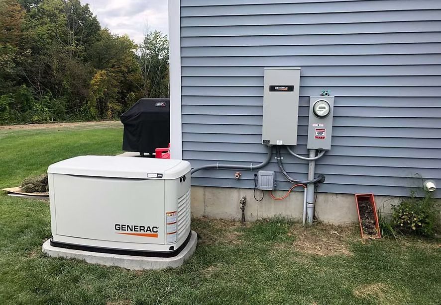 A generator is sitting on the side of a house.