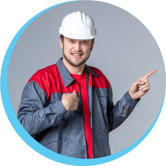 A man wearing a hard hat is pointing at something