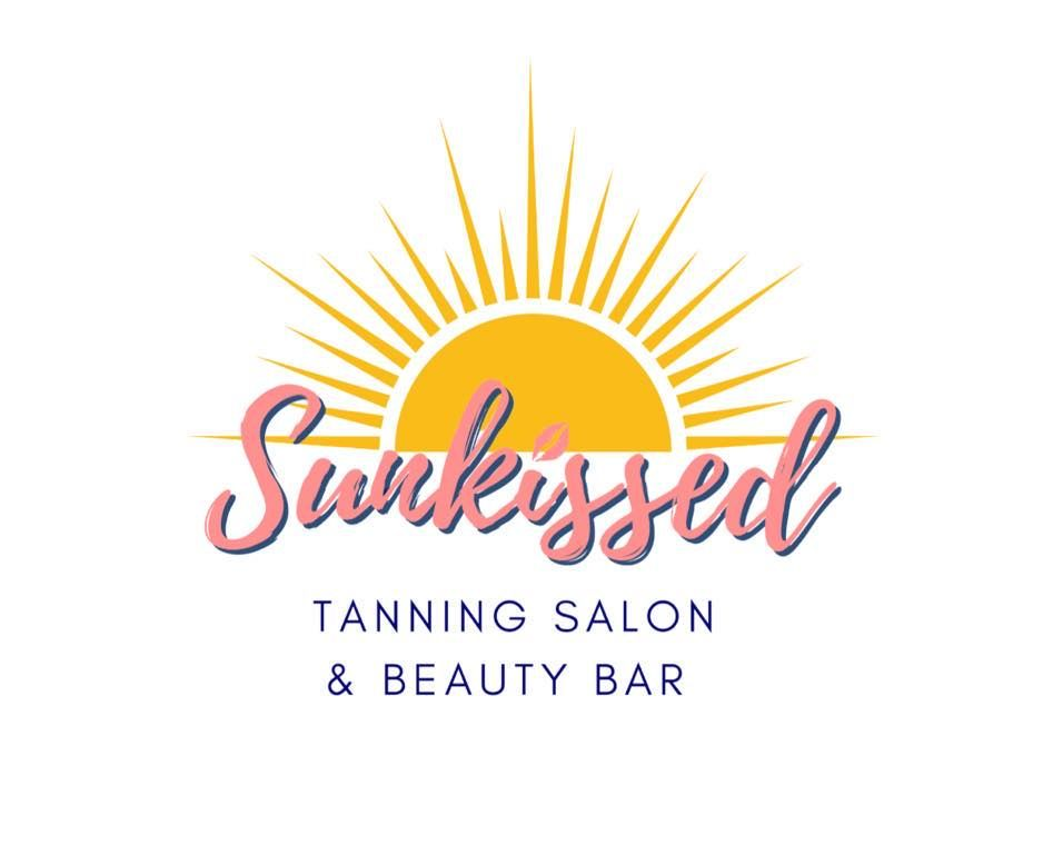 Logo for Sun-kissed tanning salon: yellow sunburst over the cursive text 
