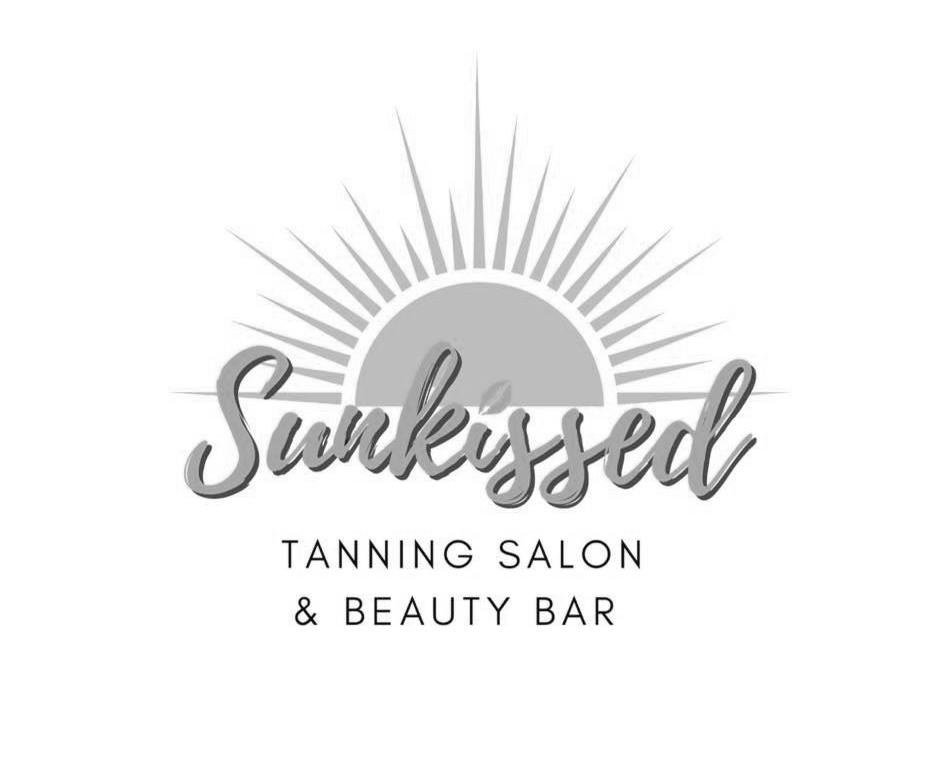 Logo for SunKissed tanning salon: a sunburst design with the word 