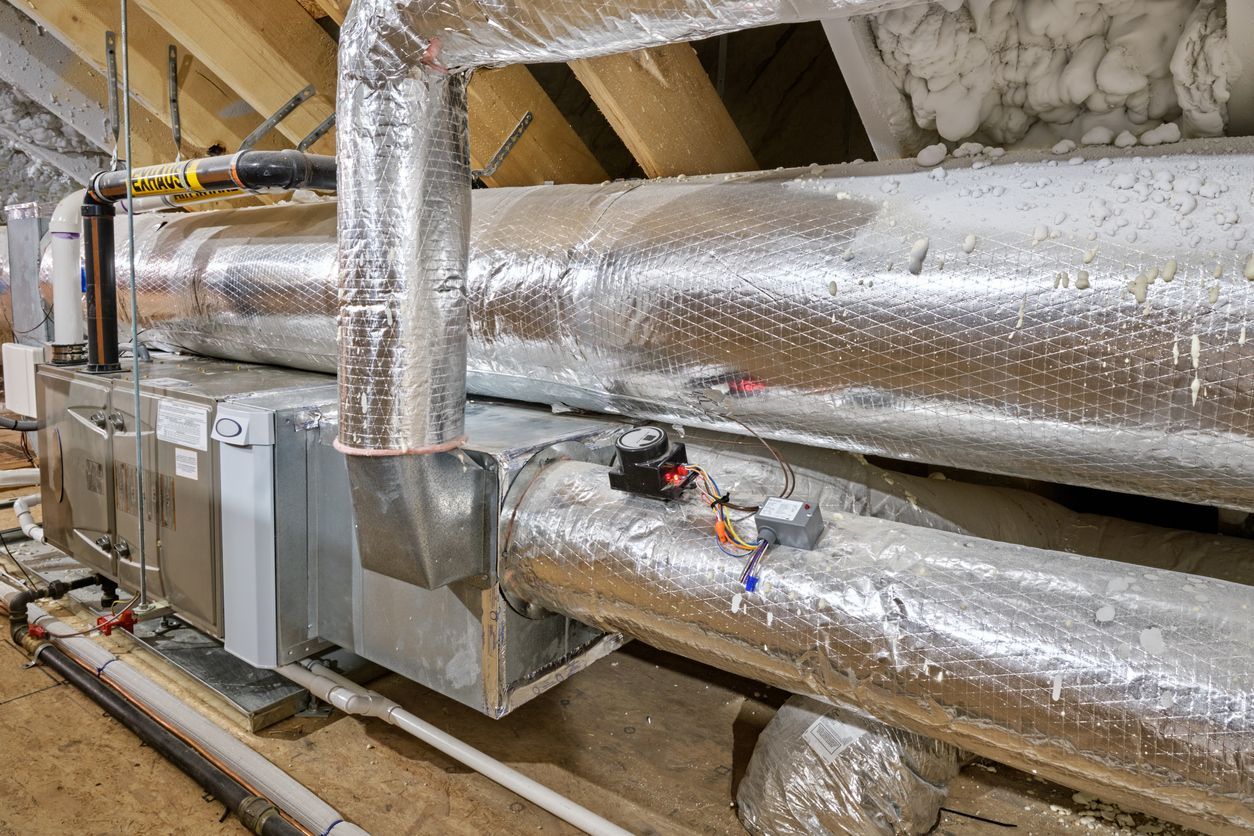 There are a lot of pipes in the attic.