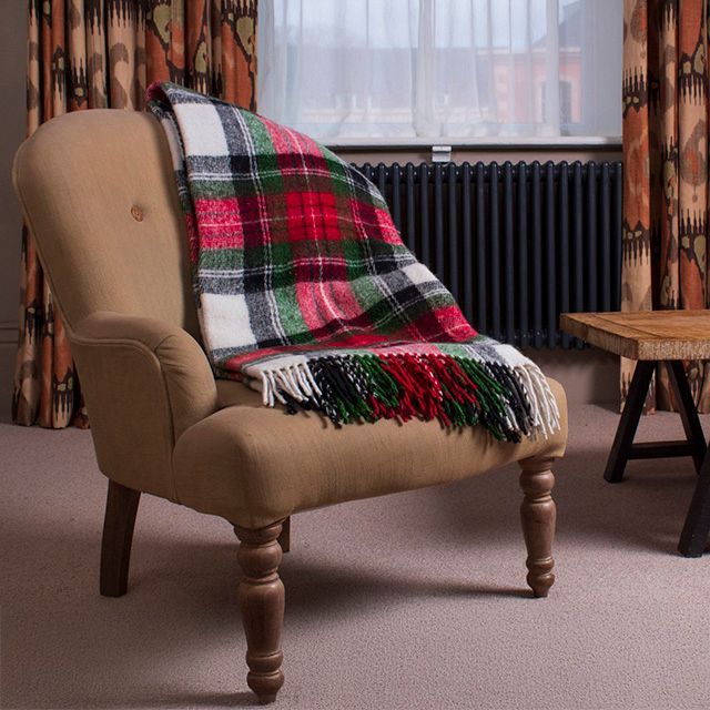 Natural wool tartan throw draped over an armchair