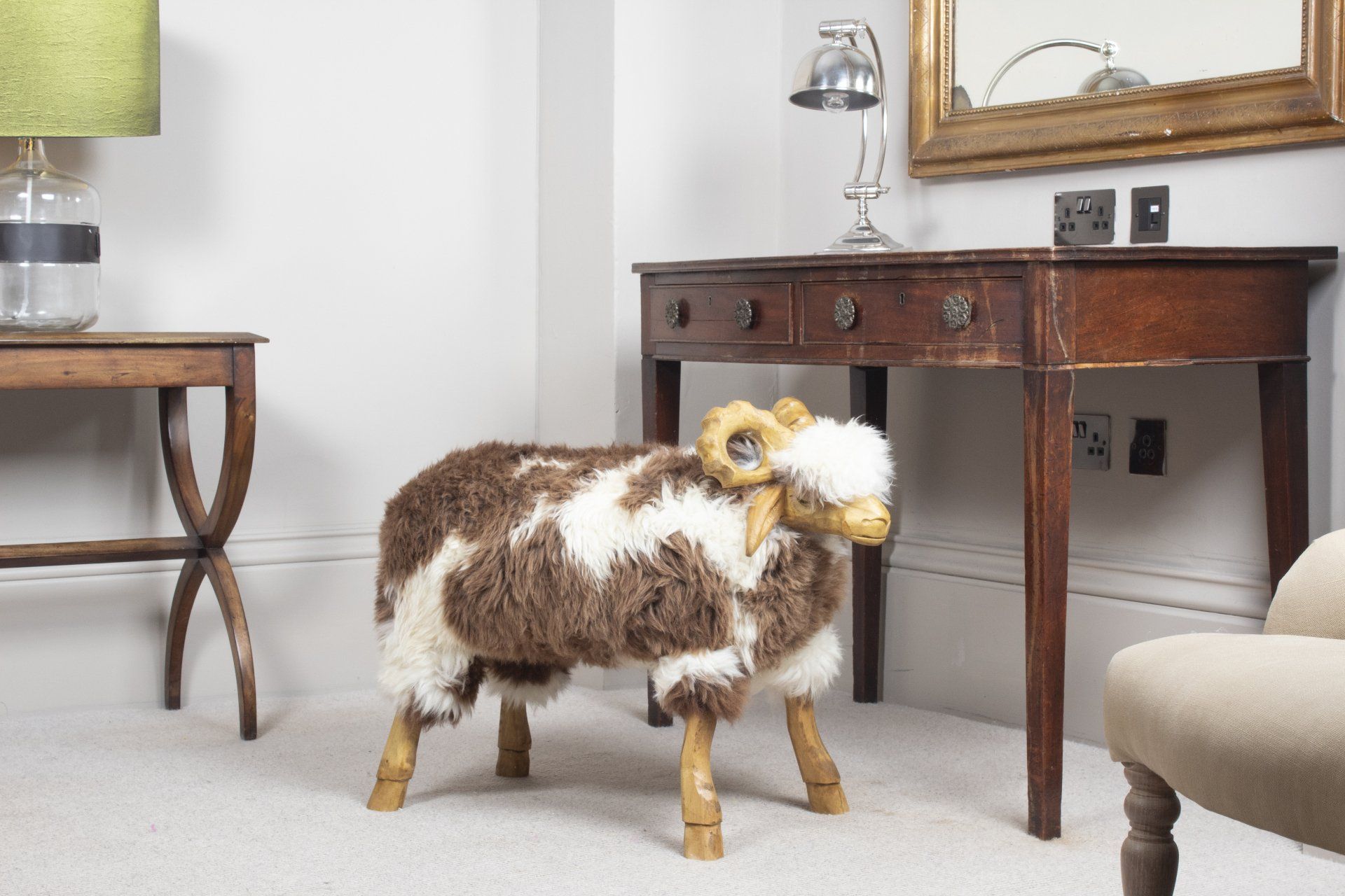 Handmade brown and white sheepskin sheep in a home interior