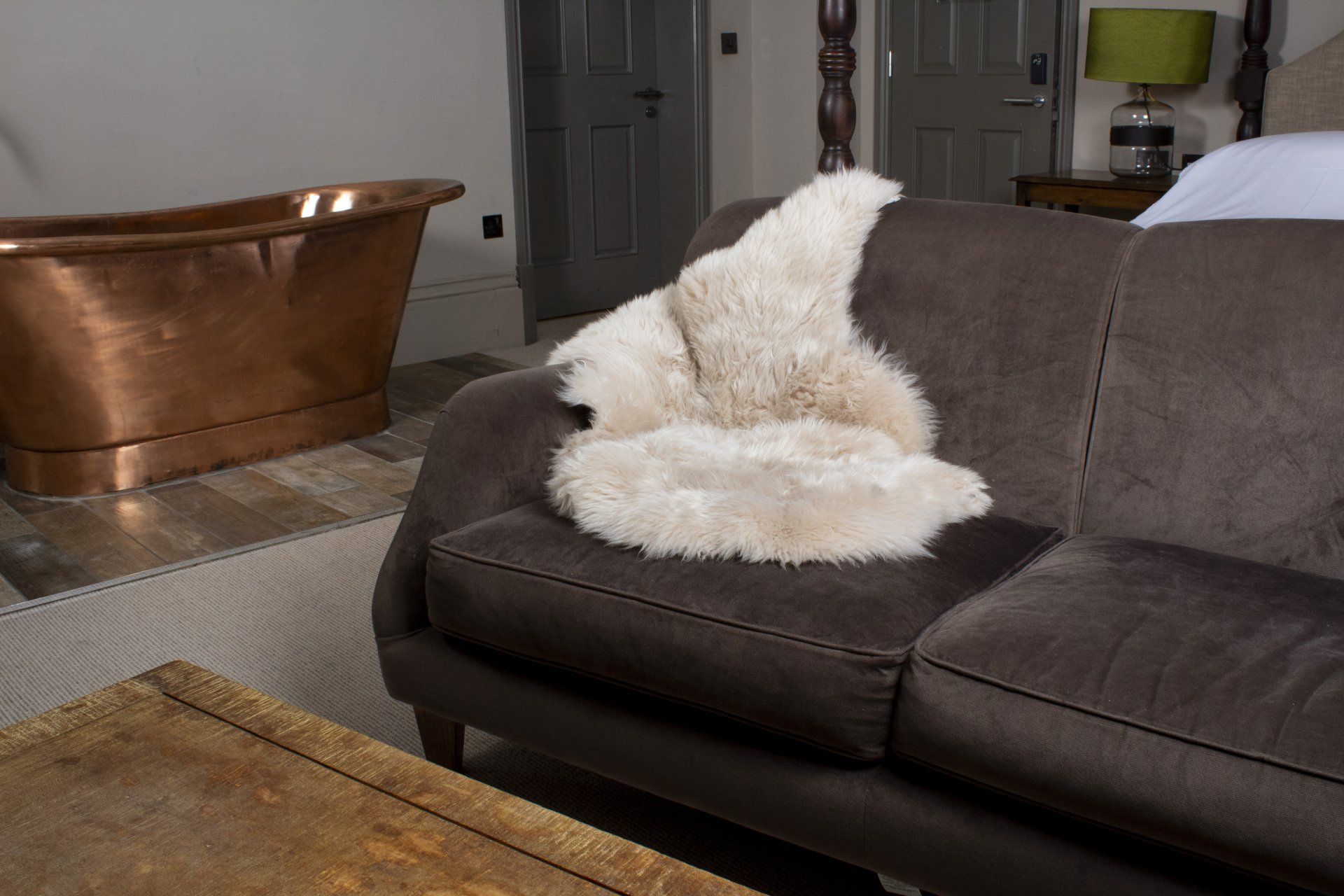 Natural cream sheepskin rug draped over an armchair
