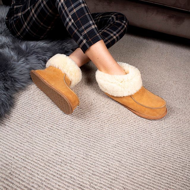 Women's beige sheepskin bootee slippers with natural wool lining