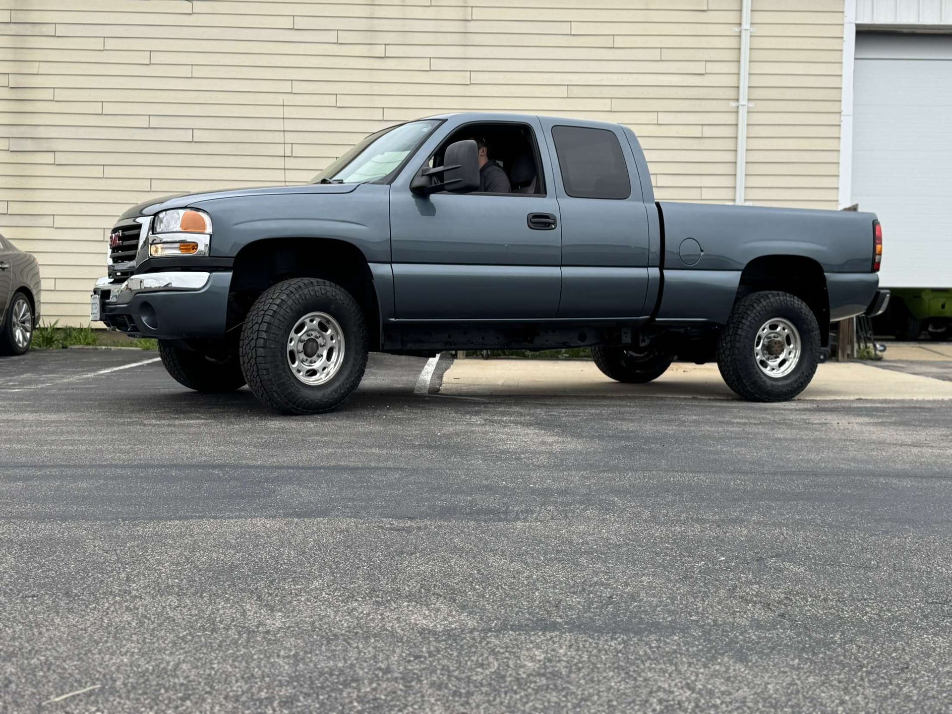 Gray pickup truck parked on asphalt.