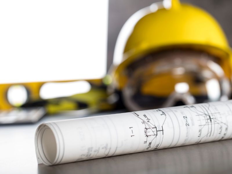 Licensed electrical contractor inspecting industrial site equipment
