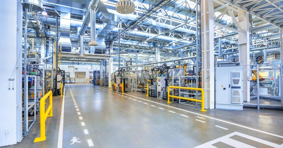 Industrial electrical contractor supporting power distribution and electrical systems inside a manufacturing facility production floor.