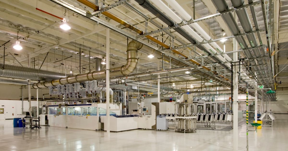 Interior industrial electrical installation showing power wiring, electrical power distribution, and lighting completed by experienced industrial and commercial electrical contractors.