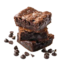 Three chocolate brownies stacked with scattered chocolate chips.