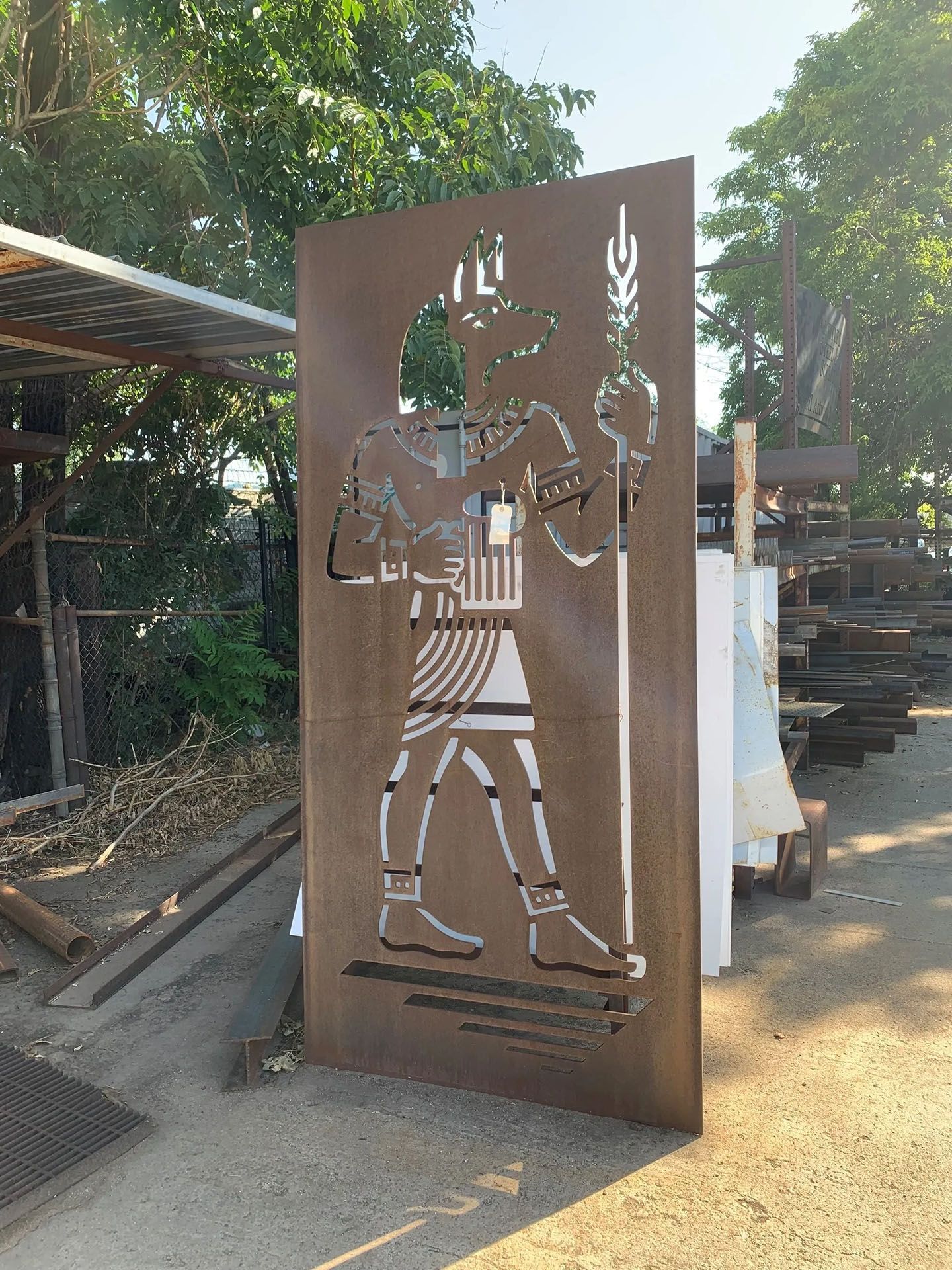 A large piece of metal with a silhouette of a man on it.