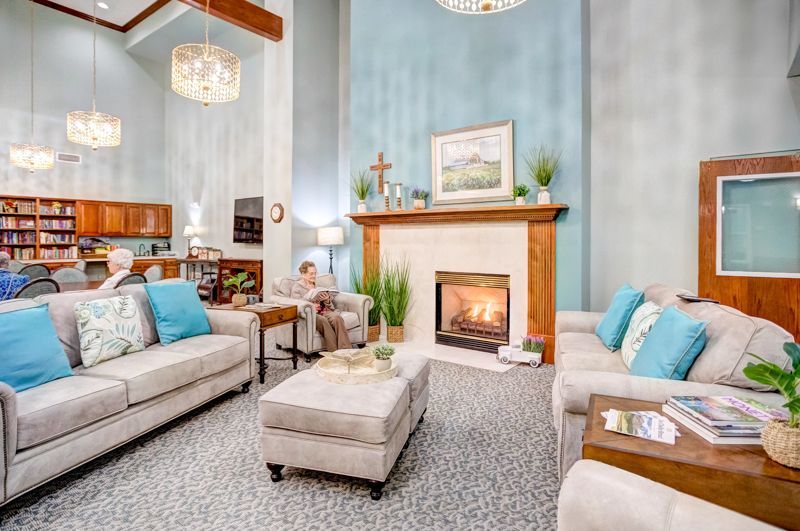 A living room filled with furniture and a fireplace.