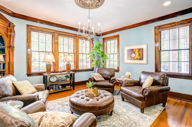 A living room filled with furniture and a chandelier.