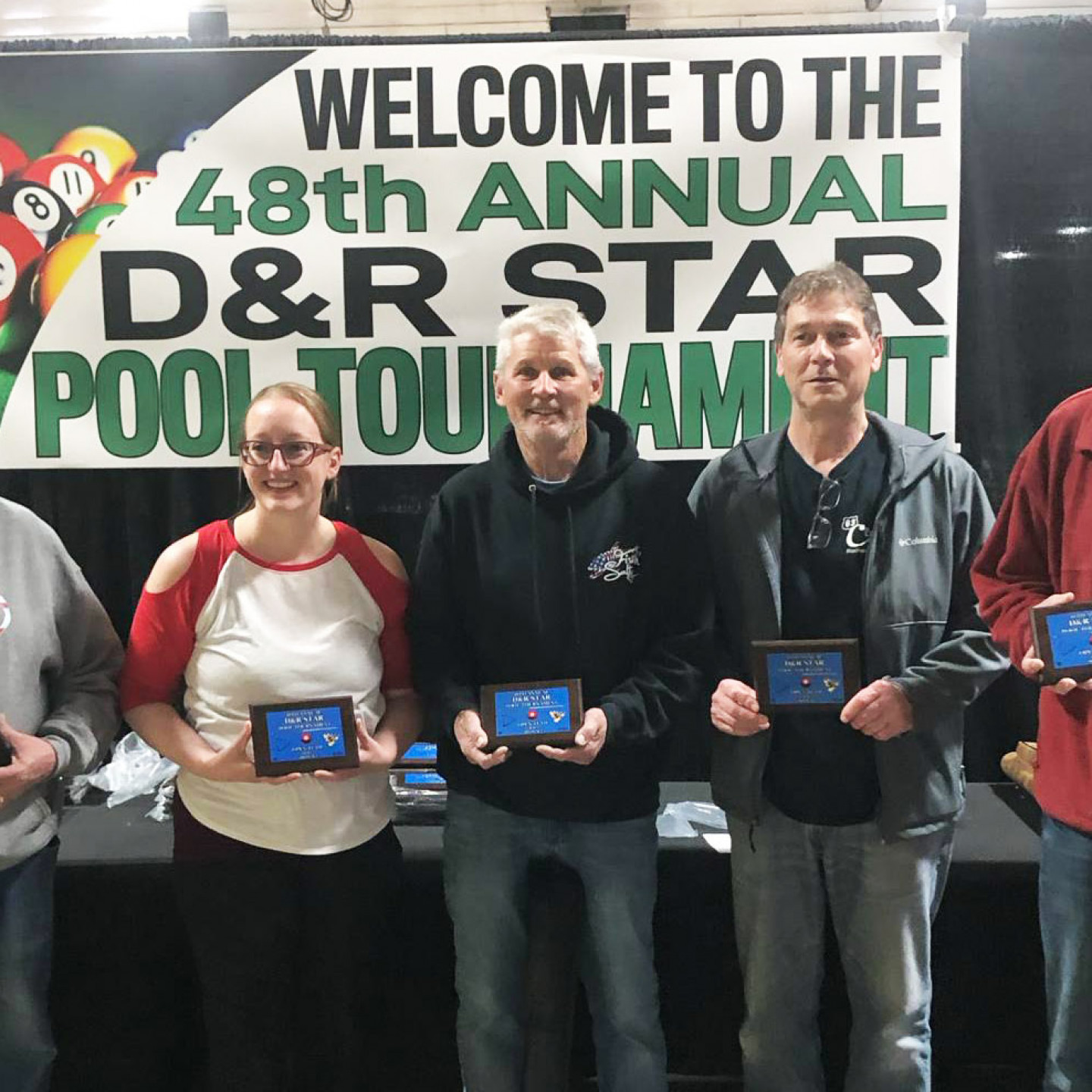 People holding awards at the 48th Annual D&R Star City Pool Tournament.