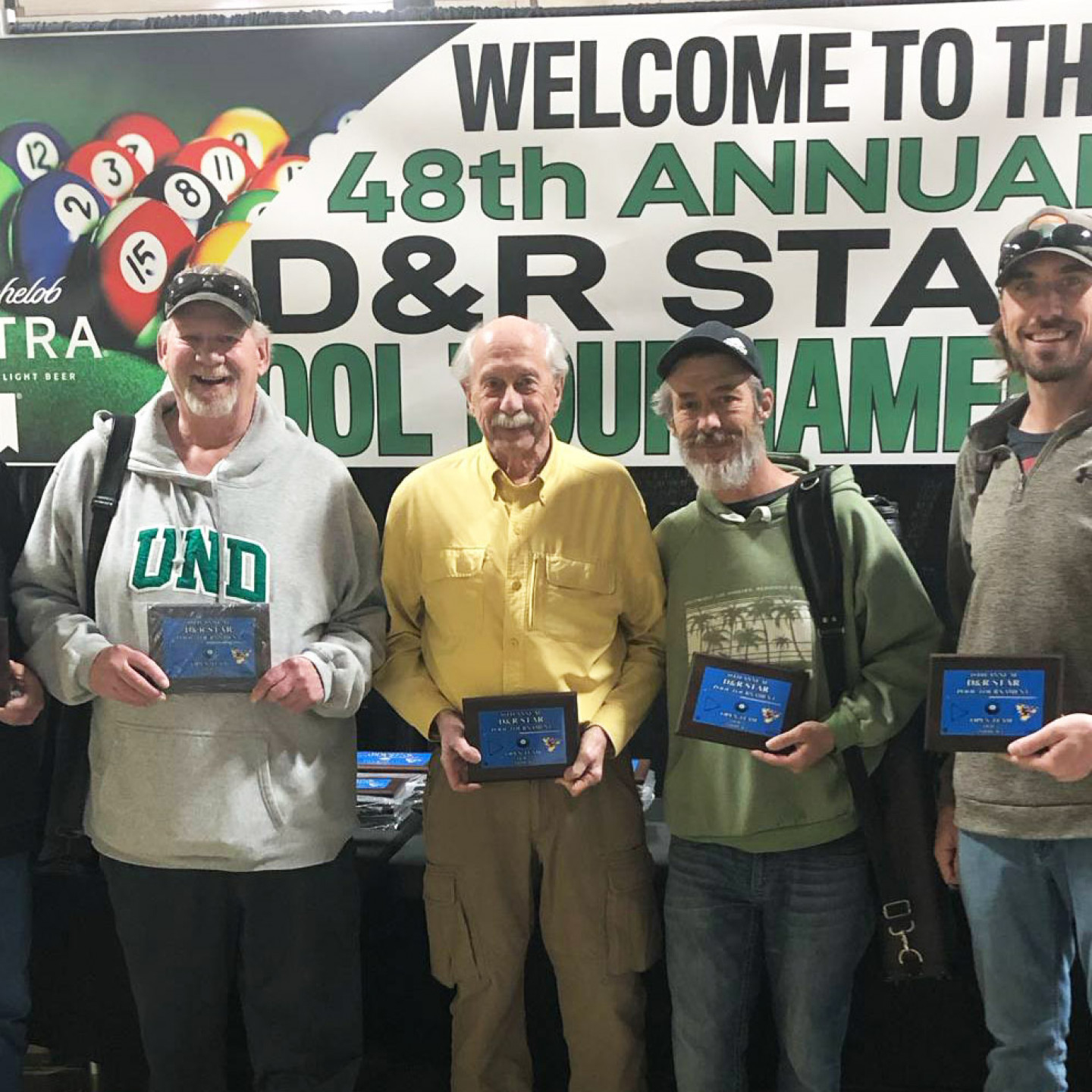 Men holding plaques pose at the 48th Annual D&R State Pool Tournament banner.