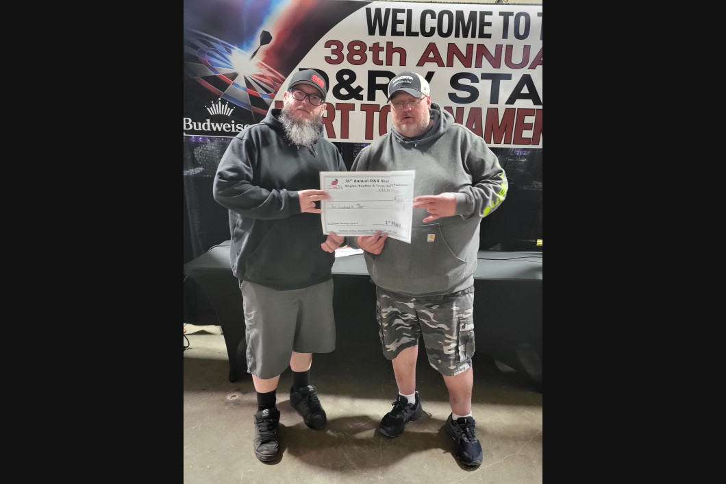 Two men holding a certificate at an event. Text reads 