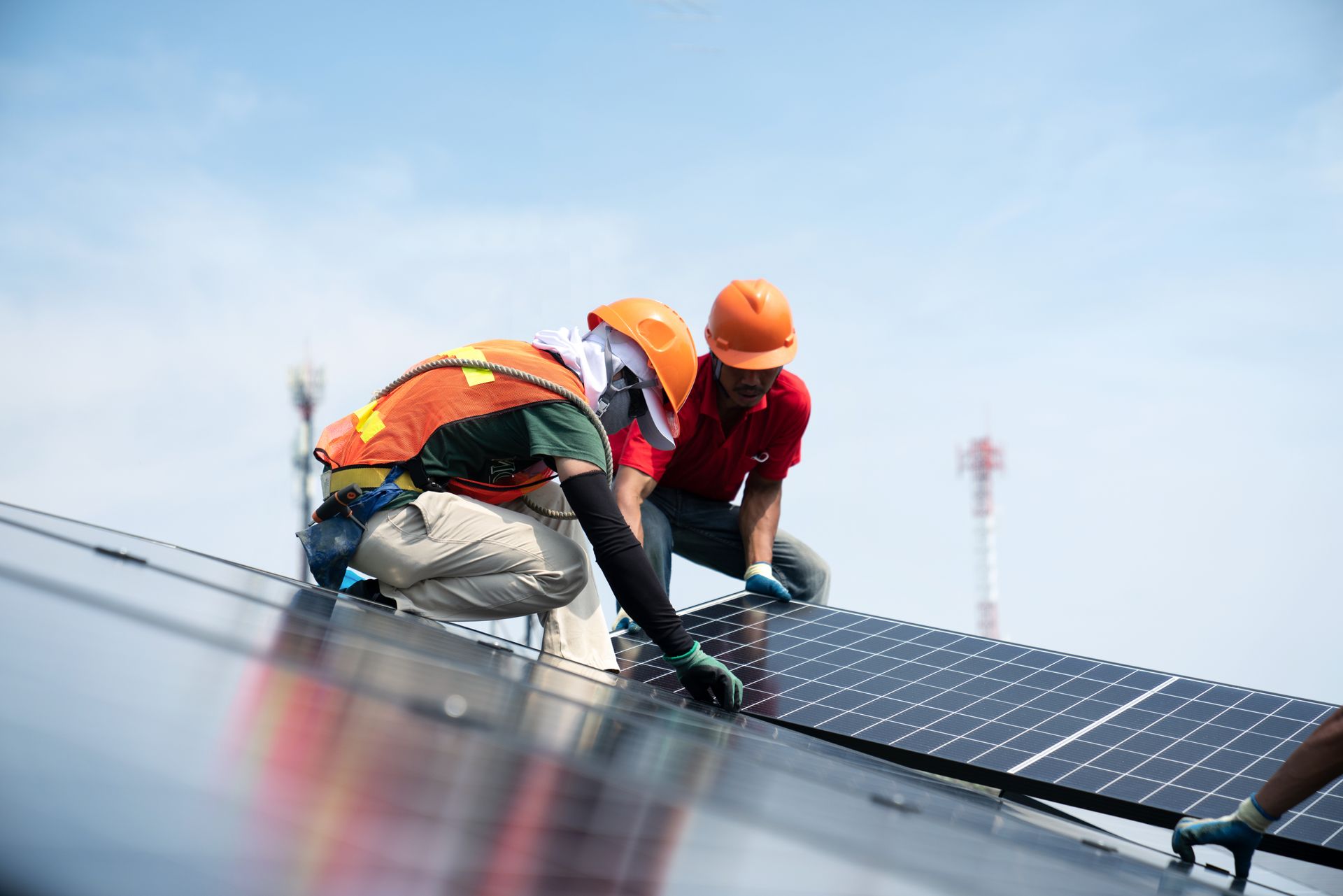 Two Roofers Installing Solar Panels