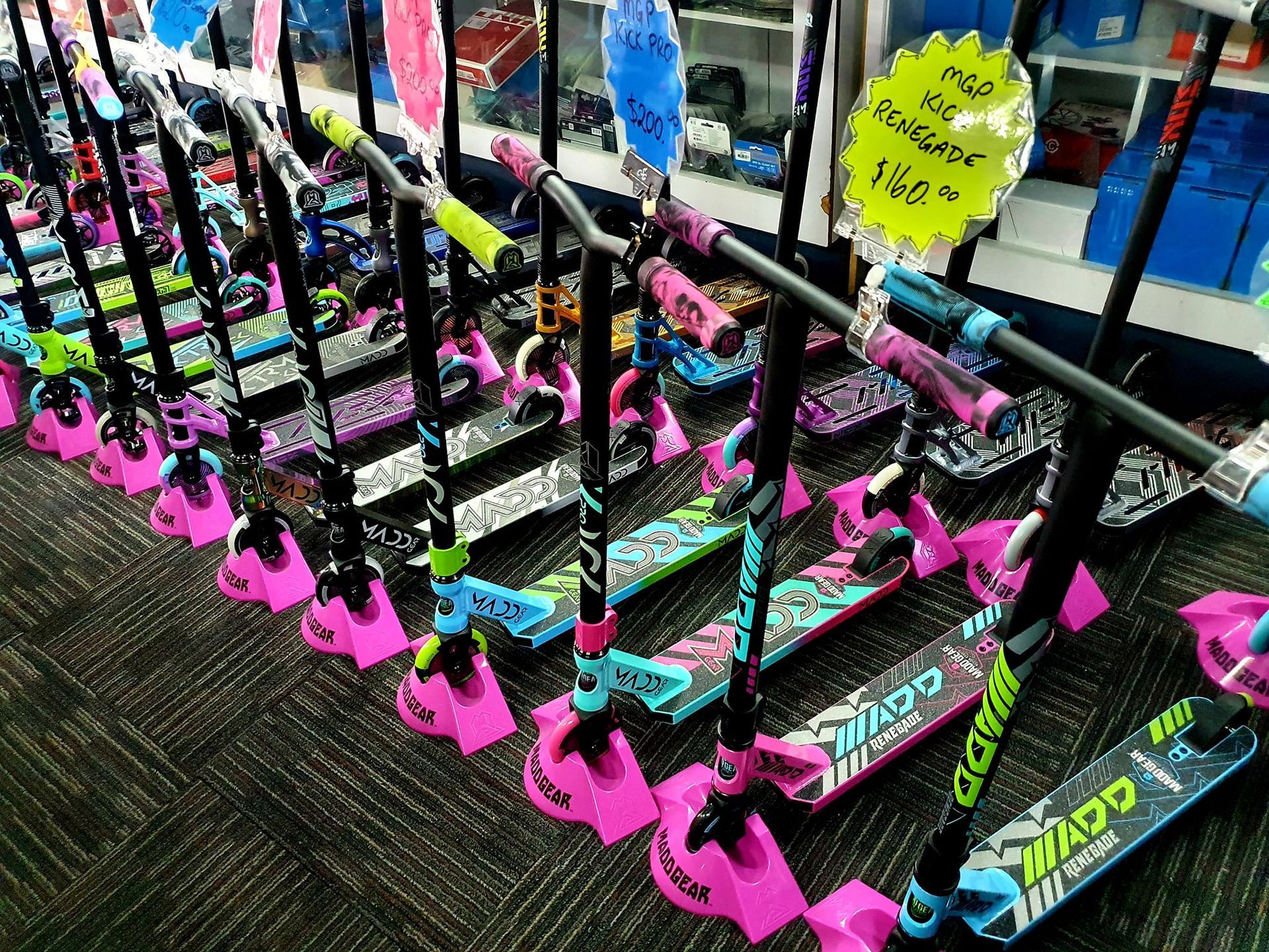 Rows of Colourful Scooters — City Centre Cycles in Berserker, QLD