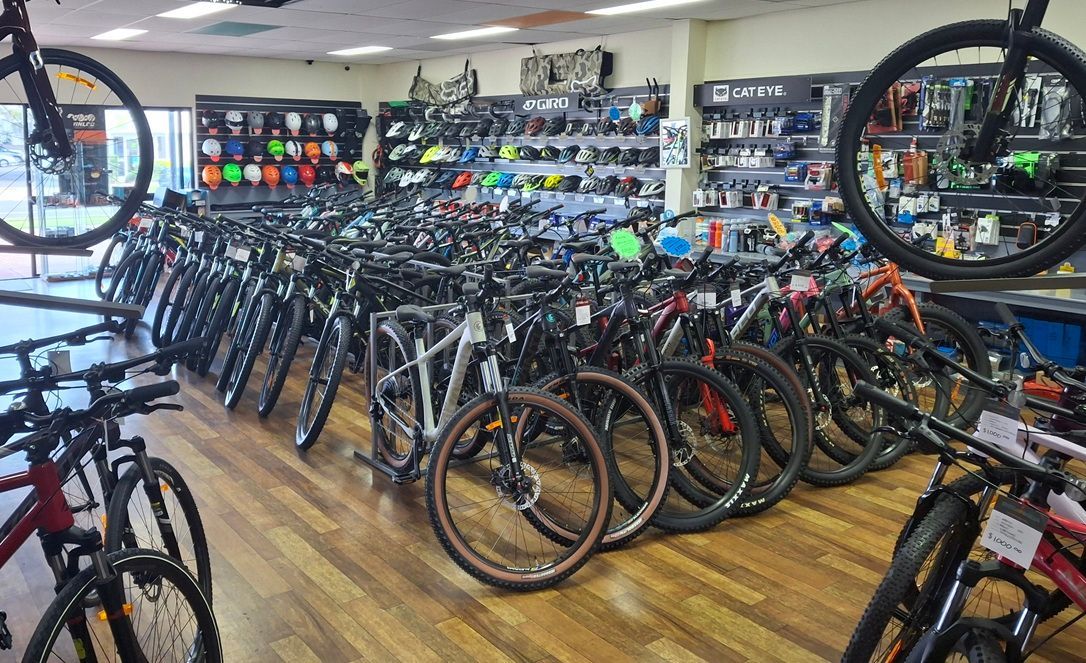 Bike Shop Showroom Filled with Rows of Bicycles on A Wooden Floor — City Centre Cycles in Berserker, QLD