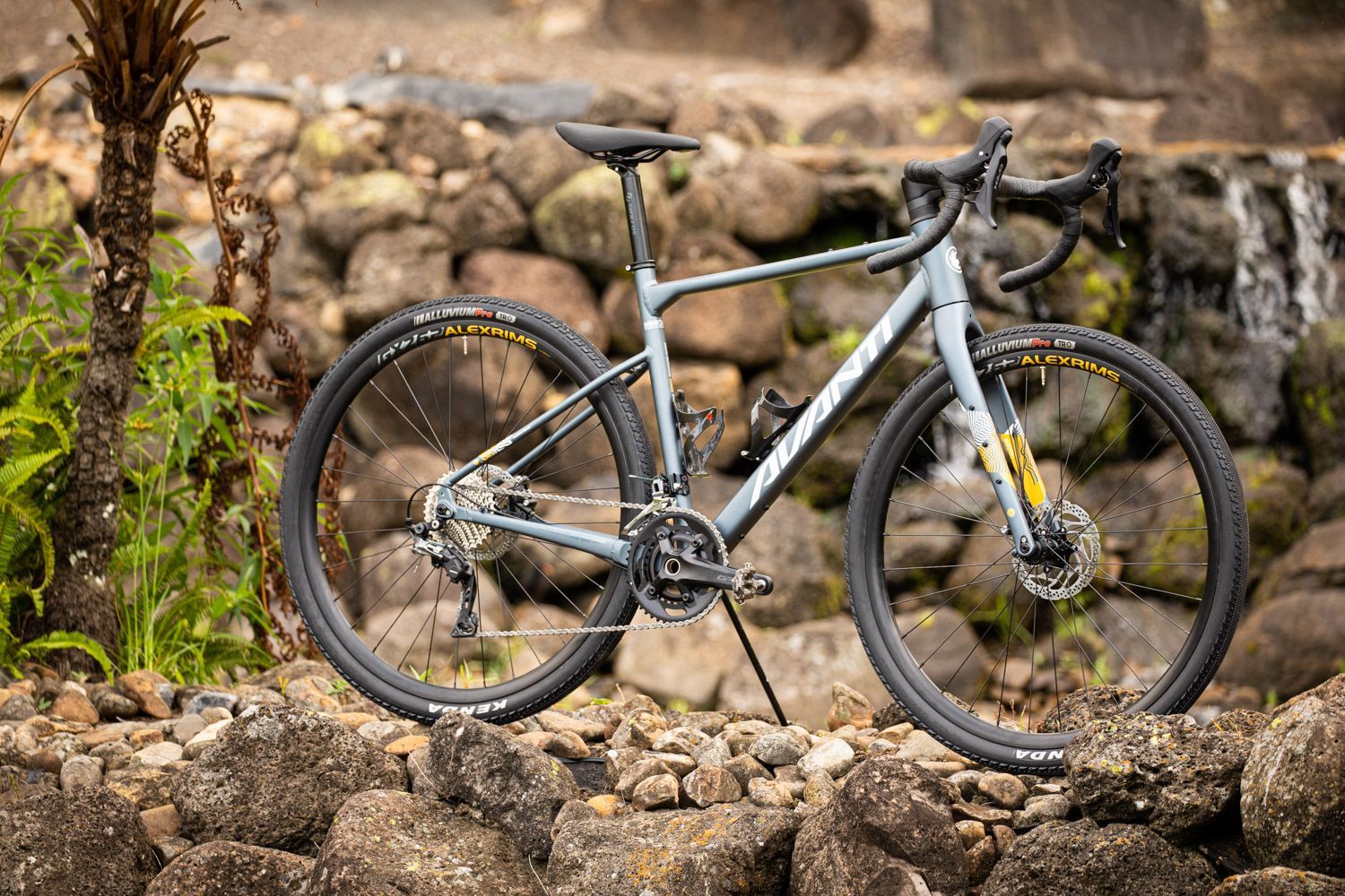 A Light Blue Gravel Bike Stands on Rocky Ground — City Centre Cycles in Berserker, QLD
