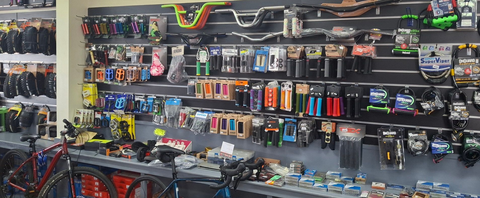 Wall Display of Assorted Bicycle Accessories and Parts in A Retail Shop — City Centre Cycles in Berserker, QLD