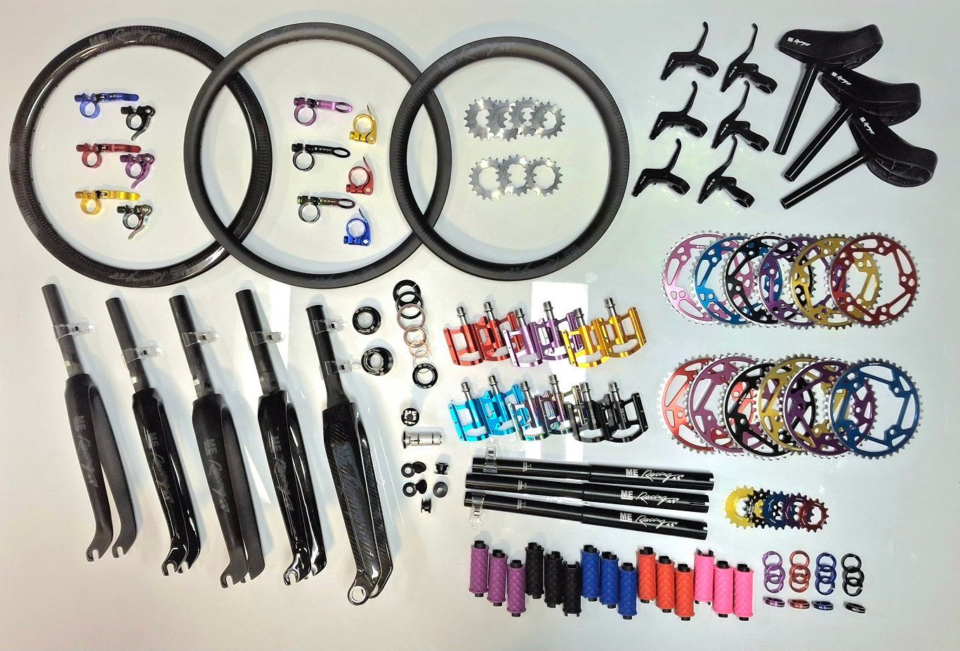 Assorted Bicycle Components Laid out On a White Background — City Centre Cycles in Berserker, QLD