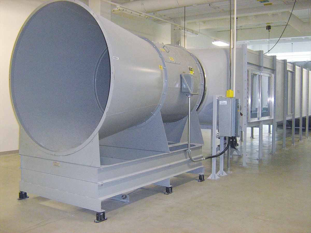 Large gray wind tunnel in a laboratory setting.