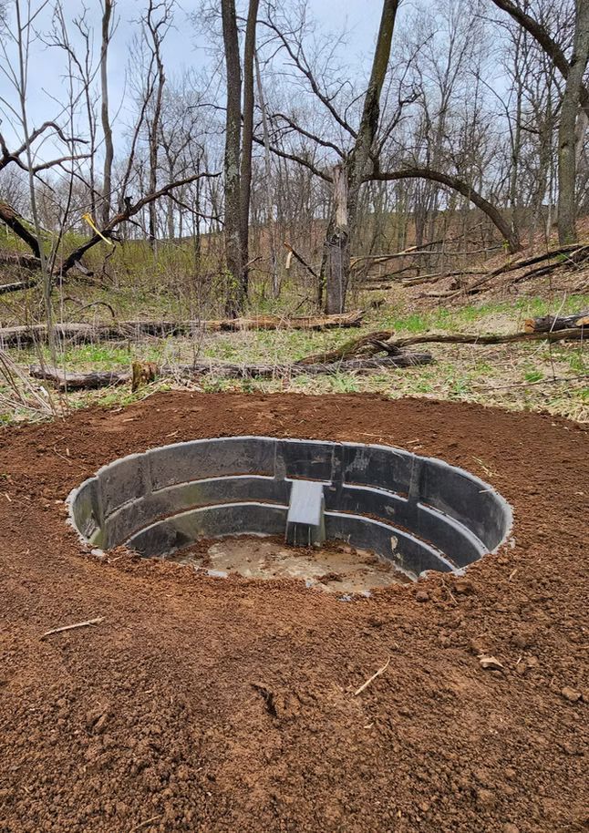 Recessed plastic water tank installed for wildlife access in Southwest Wisconsin.