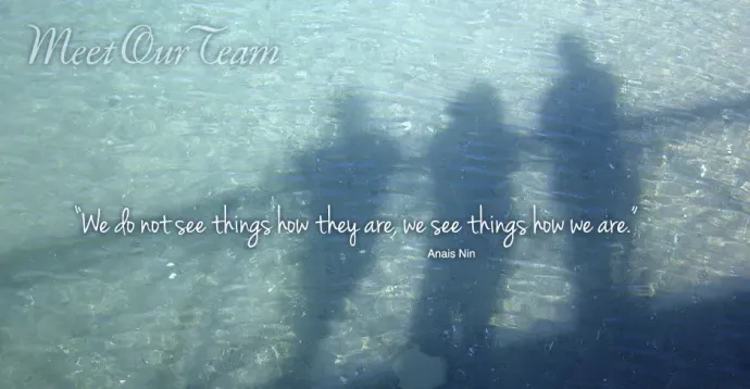 A group of people are standing in the water with a quote.