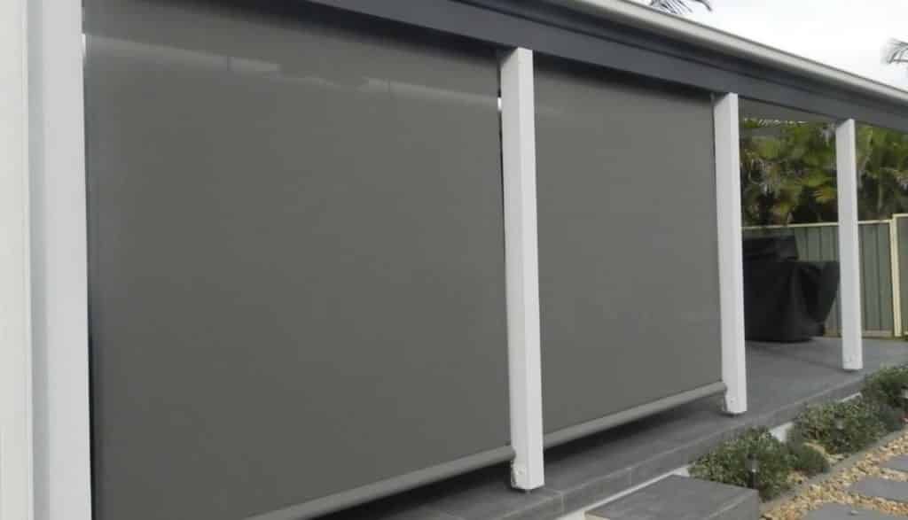 A House with a Porch with Blinds on it - Bay Blinds & Doors in Lake Charmhaven, NSW