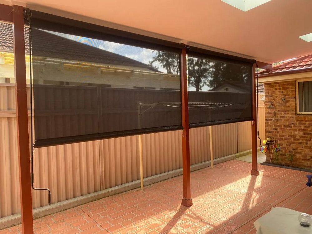 A Mobile Home with A Blue Awning on The Side of It — Bay Blinds & Doors in Bateau Bay, NSW