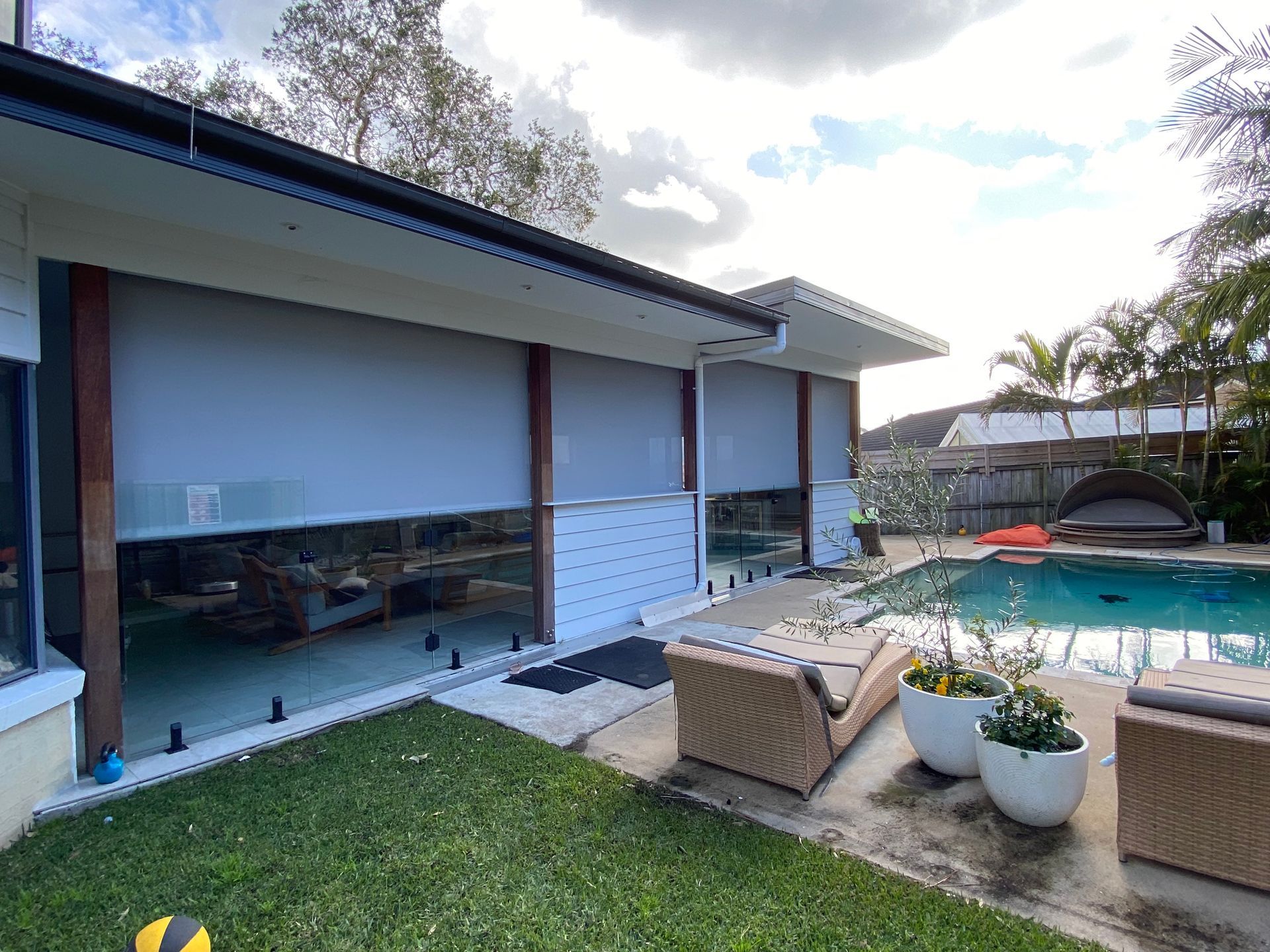 A House with A Porch with Blinds on It — Bay Blinds & Doors in Woy Woy, NSW