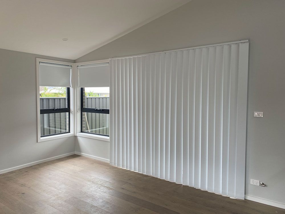 There Are Two Windows in The Room with White Blinds — Bay Blinds & Doors in Bateau Bay, NSW