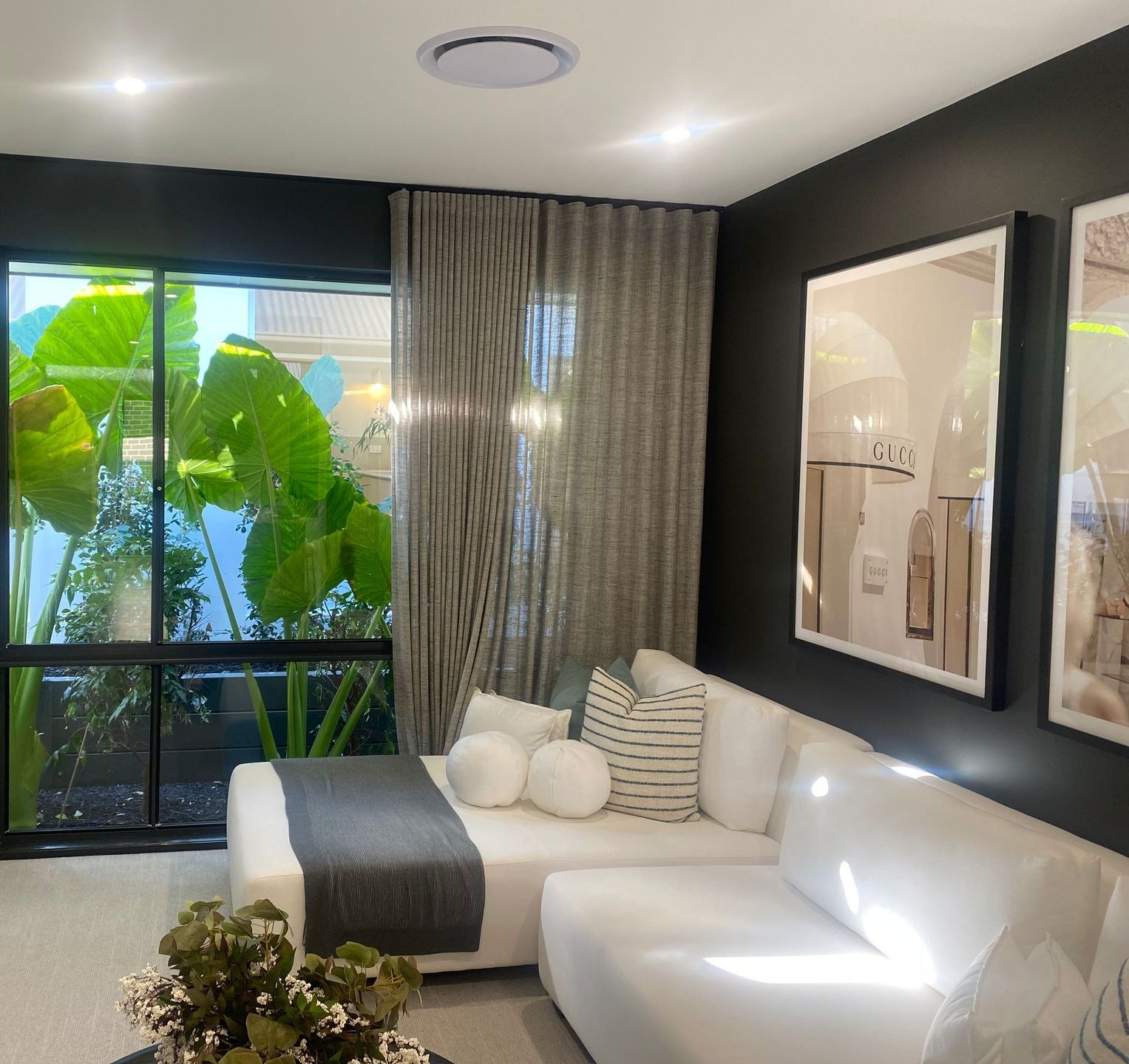 A Kitchen With a Table and Chairs and a Sink — Bay Blinds & Doors in Bateau Bay, NSW