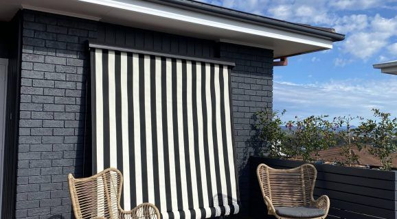 A House with A Porch with Blinds on It — Bay Blinds & Doors in Wyong, NSW