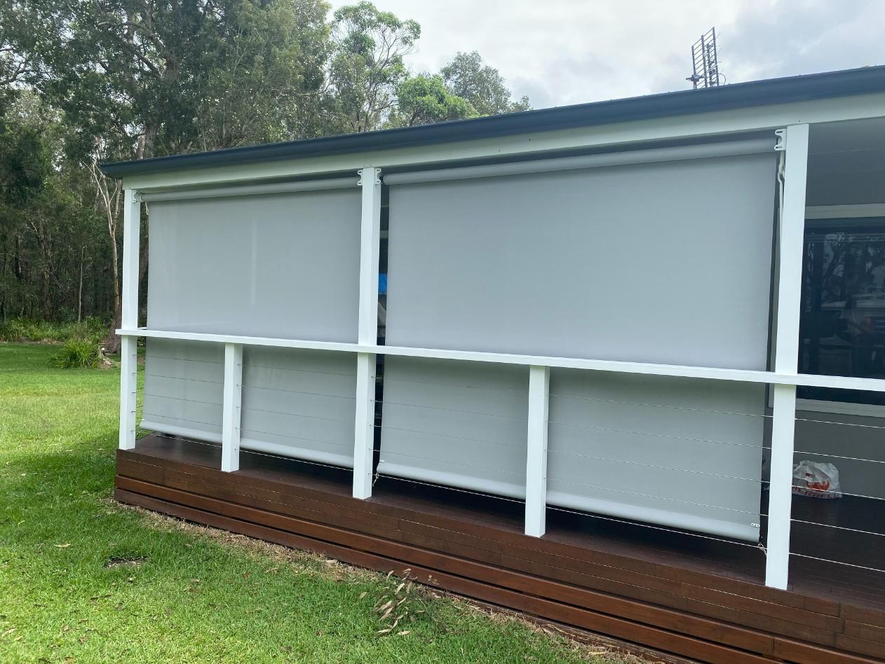 A House with A Porch with Blinds on It — Bay Blinds & Doors in Berkeley Vale, NSW