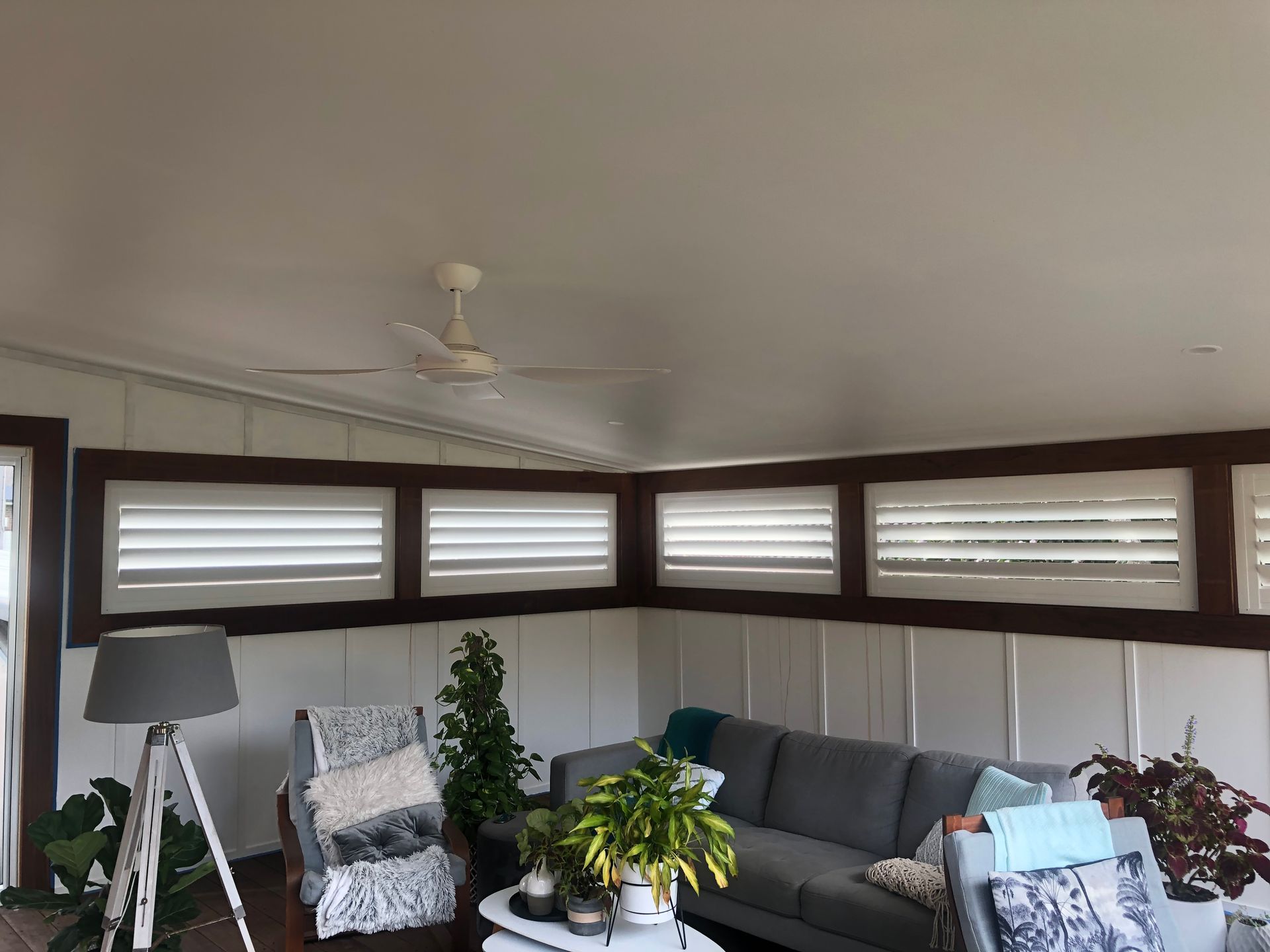 A Room With a Bed and a Lantern Hanging From the Ceiling — Bay Blinds & Doors in Bateau Bay, NSW