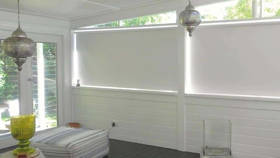 A Building with A Lot of Windows and Blinds on It — Bay Blinds & Doors in Woongarrah, NSW