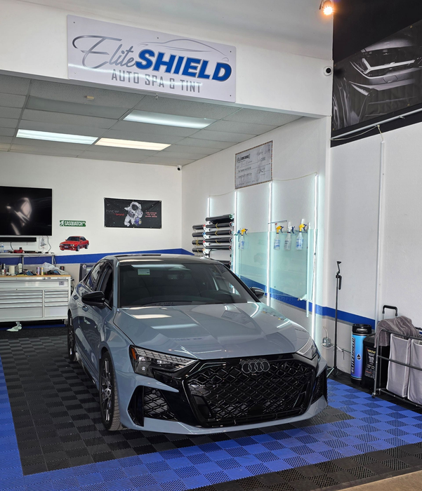 Gray car in a shop with 