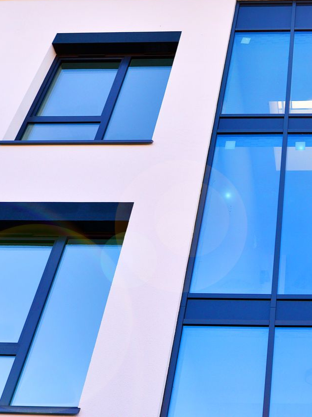 Blue-tinted windows on a modern building facade
