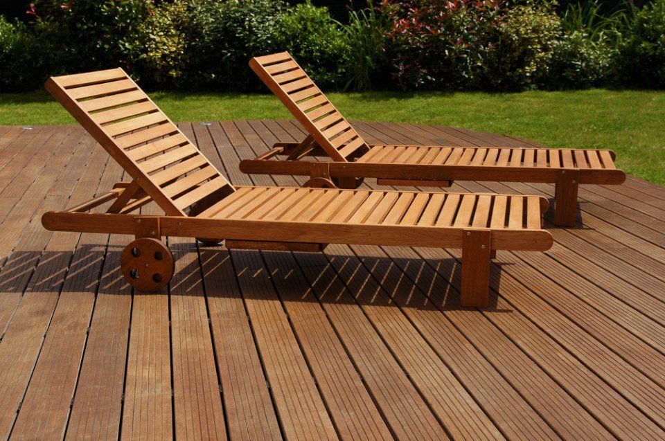 two lounge chairs on wood deck