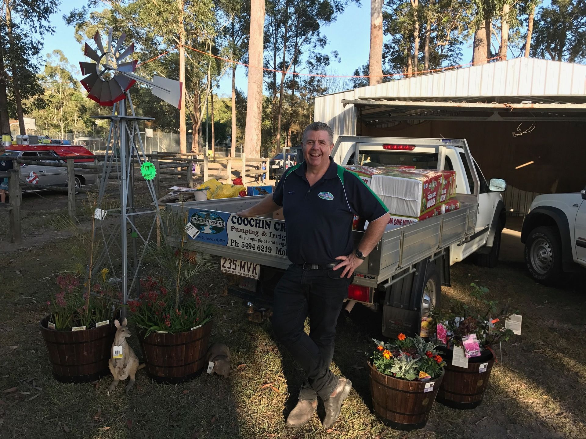 A man is sitting on the back of a truck. — Beerwah Co-Op in Beerwah, QLD