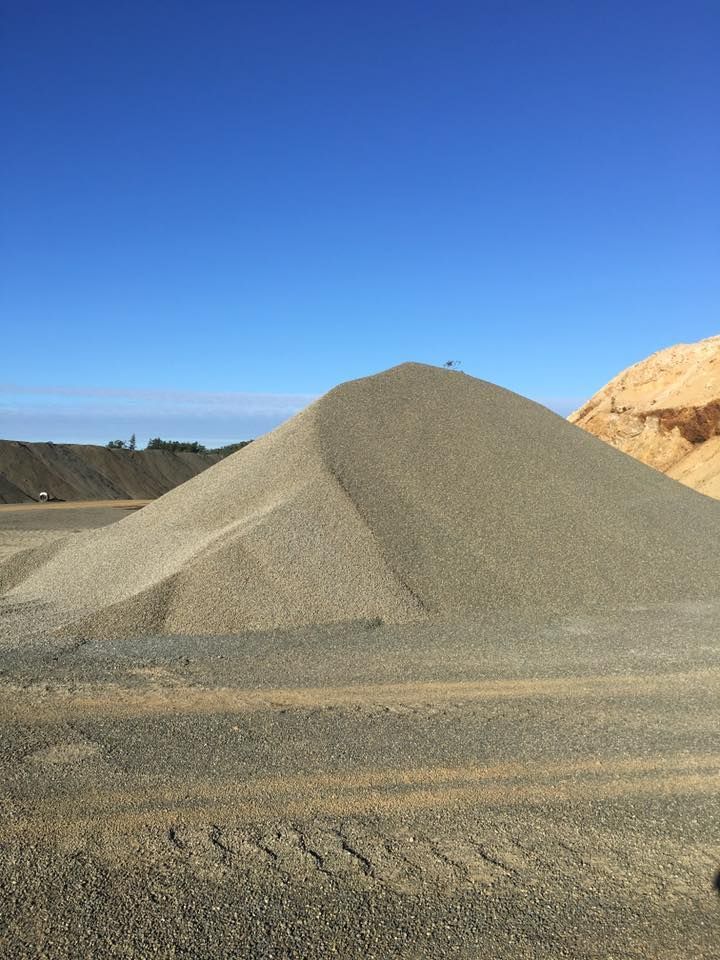 Pile of Gray Gravel Against a Clear Blue Sky — The Caves Quarry CQ in The Caves, QLD
