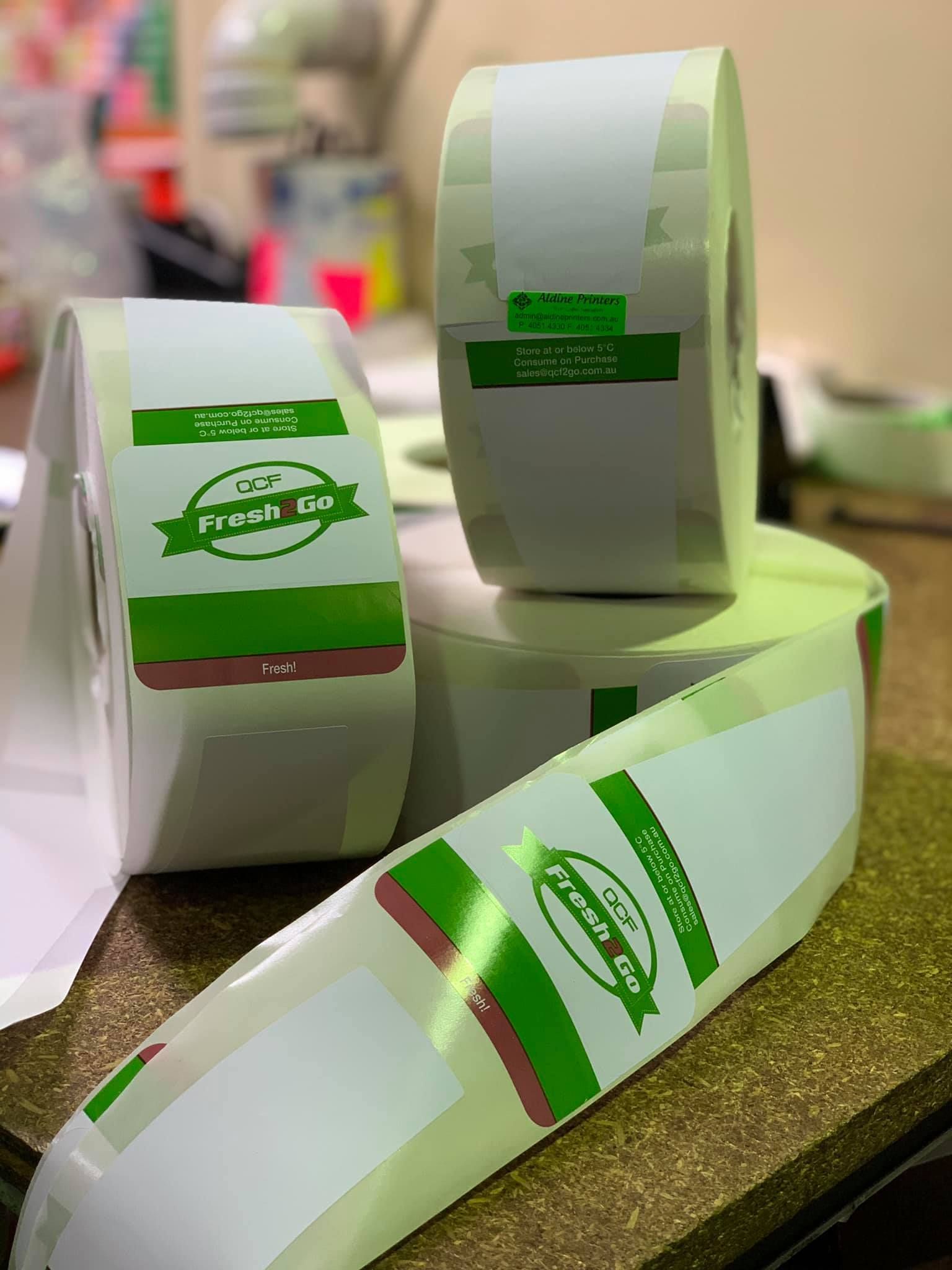 Three Rolls of Labels are Stacked on Top of Each Other on a Table — Aldine Printers in Bungalow, QLD