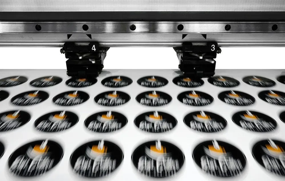 A Bunch of Stickers are Being Printed on a Machine — Aldine Printers in Bungalow, QLD