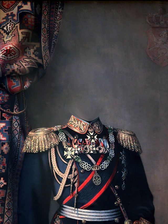 Military uniform with elaborate gold epaulettes, medals, and a red sash. Dark backdrop, ornate patterned curtain.
