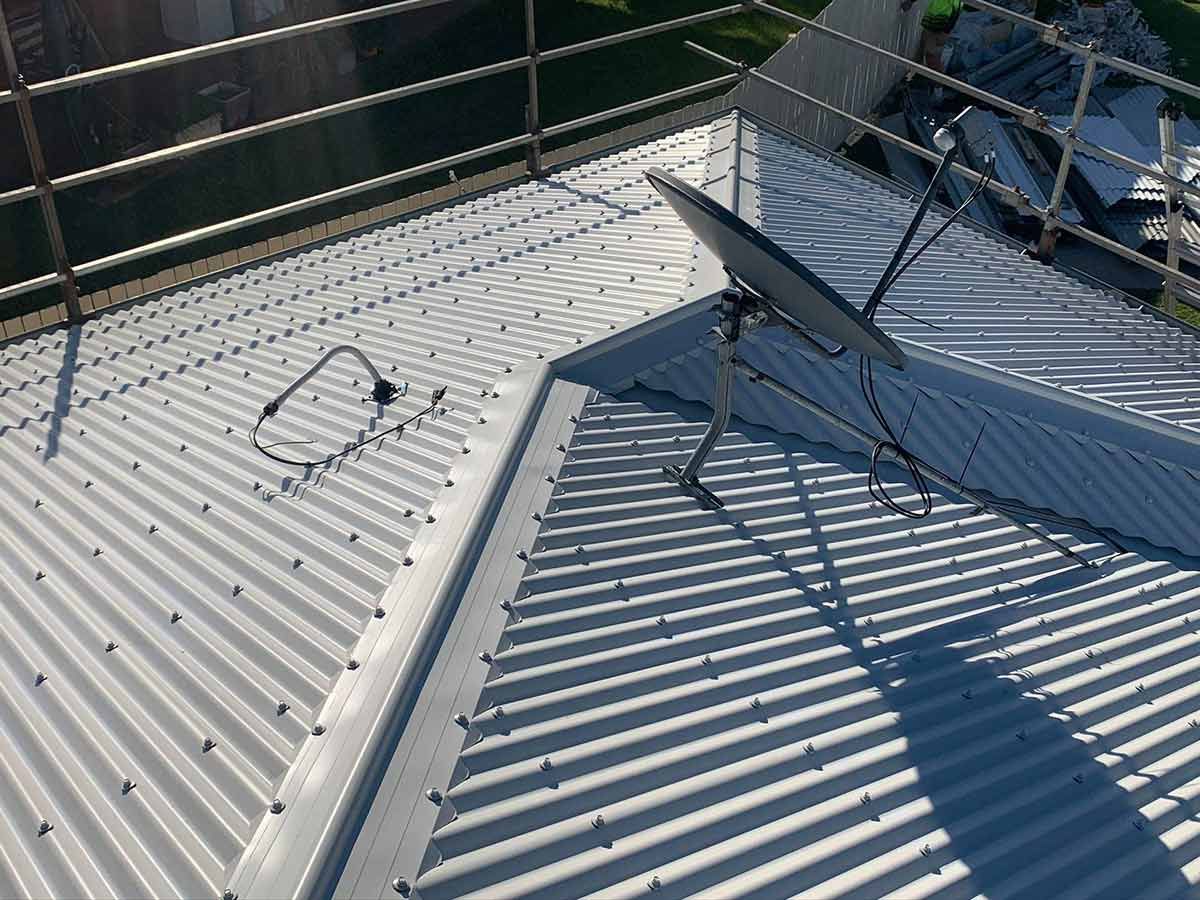A Satellite Dish is Sitting on the Roof of a Building — Ben McLennan Constructions in Armidale, NSW