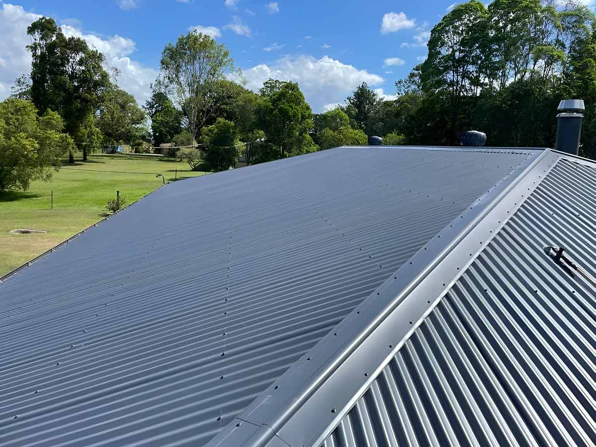 A Roof of a House With Trees in the Background — Ben McLennan Constructions in Glenn Innes, NSW