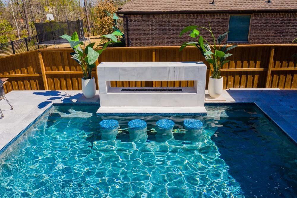 Custom swim-up pool bar with in-water seating
